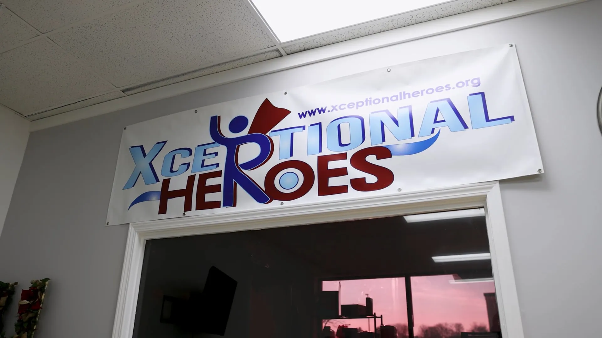 A scene from the Xceptional Heroes community video — Heroes, volunteers, and families together.